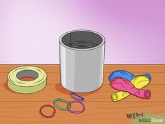 a bucket, scissors and other items on a table