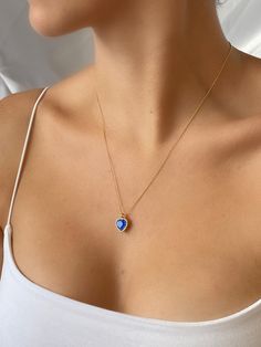 14K Gold Plated Hearth Pendant Necklace Features; * Gold Filled Stainless Steel Material * Gold Filled Flat Brass Cable Chain * Blue Cubic Zirconia Heart Shaped Charm * Lobster Clasp Closure Blue Heart Pendant, Necklace Minimalist, Necklace Blue, Necklace Dainty, Blue Heart, Minimalist Necklace, Birthstone Necklace, Dainty Necklace, Heart Pendant Necklace