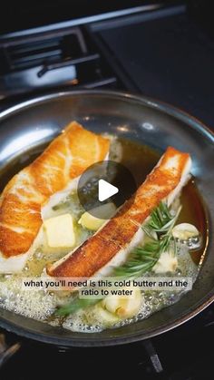 a frying pan filled with fish and vegetables on top of a stovetop next to an oven