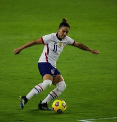 a female soccer player in action on the field