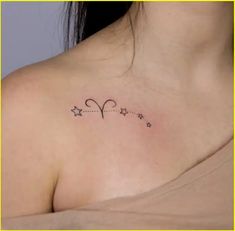 a woman with a small tattoo on her chest