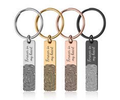 four different types of key chains with engraved names