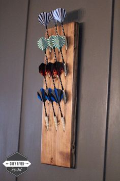 a wooden board with several different types of hair clips on it