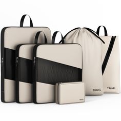 three pieces of luggage sitting next to each other in front of a white bag with black trim