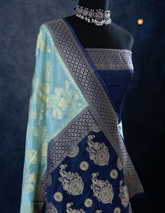 Indulge in luxury with our Sky Blue Khaddi Silk saree, adorned with delicate Golden Jaal work. Featuring a lightweight and airy fabric, this saree offers both comfort and elegance. Elevate your style with this beautiful saree and leave a lasting impression on any occasion! Luxury Blue Katan Silk Dupatta, Luxury Royal Blue Banarasi Silk Dupatta, Blue Pre-draped Saree With Zari Weaving For Navratri, Elegant Blue Pre-draped Saree With Zari Weaving, Traditional Blue Pre-draped Saree With Dupatta, Traditional Blue Pre-draped Saree With Self Design, Blue Dola Silk Pre-draped Saree With Zari Weaving, Blue Dola Silk Pre-draped Saree With Pallu, Blue Bollywood Banarasi Silk Pre-draped Saree