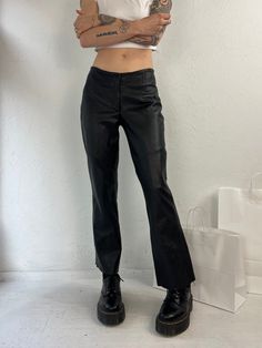 "- Wilsons leather black low rise flares - 100% leather shell with polyester lining - Zipper and hooke and eye fly - Tagged 2 Waist: 28\" Rise: 8\" Hip: 18\" Inseam: 28\"" Leather Pants Low Rise, Low Waisted Leather Pants, 90s Style Fitted Black Pants, Low Rise Leather Pants, Leather Trousers Women, Low Rise Flare Pants, Lederhosen Outfit, Low Waist Pants, Plaid Pleated Mini Skirt