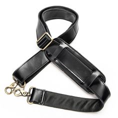 a black leather leash with gold hardware on a white background for use in clothing and accessories