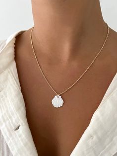 Mother of pearl shell pendant on a dainty gold-filled figaro chain! Beautiful pop of white for the summer time. Elegant White Shell Necklace For Summer, White Shell Necklace With Clavicle Chain, White Shell Charm Necklace As Gift, White Shell Charm Necklace For Gift, White Summer Jewelry With Adjustable Chain, White Shell Charm Necklace Gift, White Jewelry With Adjustable Chain For Summer, Summer White Necklace With Adjustable Chain, White Shell Dainty Jewelry