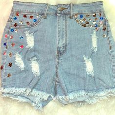 Jean Bedazzled Shorts Trendy High Waist Jean Shorts For Parties, Trendy Sequined Shorts For Spring, Sequin Denim Bottoms For Spring, Blue Denim Sequined Bottoms, Trendy Sequined Bottoms For Summer, Trendy Sequined Summer Bottoms, Party Denim Jean Shorts With Rhinestones, Rhinestone Denim Jean Shorts For Party, High Waist Jean Shorts With Rhinestone Fringe For Party