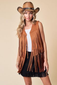 Introducing our Maple Fringed Vest! A versatile and stylish addition to your wardrobe. Crafted with soft, lightweight fabric, this vest offers both comfort and style for any occasion. The fringe detailing along the hem adds a bohemian touch, while the open-front design allows for easy layering. Elevate your outfit with this chic vest that's perfect for adding flair to any look. Soft and lightweight fabric for all-day comfort Fringe detailing along the hem adds a bohemian flair Versatile open-front design allows for easy layering Perfect for adding style to any outfit, from casual to dressy Chic Open Front Fall Vest, Summer Bohemian Outerwear With Frayed Hem, Trendy Summer Outerwear With Fringe, Sleeveless Outerwear For Summer Festivals, Summer Festival Sleeveless Outerwear, Bohemian Vest Outerwear For Fall, Bohemian Sleeveless Outerwear For Spring, Bohemian Sleeveless Vest For Day Out, Bohemian Fringe Outerwear For Summer