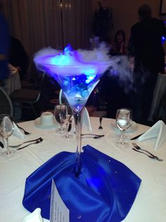 a blue and white table cloth with a glass on it