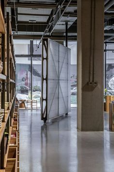 the inside of a building with lots of shelves