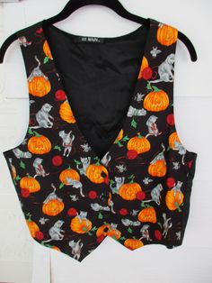 "(IMPORTANT! Please check the measurements posted below and compare same with your own clothes before buying Love this waistcoat! Hey you cat lovers! A cute pumpkin and cat vest/waistcoat! 100% cotton and lining, with button front for closure and suitable for most occasions. In very good condition. PS: I've lowered the price (measured flat and closed) Width underarm to underarm 20 inches Length shoulder to hem 23 inches Length underarm to hem 9 inches Width bottom hem to hem 20 inches Width one Halloween Vest, Vintage Waistcoat, Casual Halloween, 70s Outfits, Grunge 90s, Vest Waistcoat, Cute Lazy Outfits, Lazy Outfits, Vest Outfits