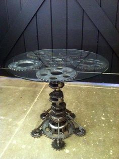 a glass table with gears sitting on top of it