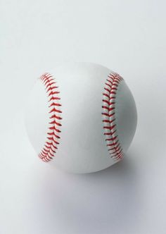 a white baseball with red stitching on the outside and inside is shown against a white background