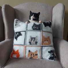 a black and white cat laying on top of a crocheted pillow in a chair