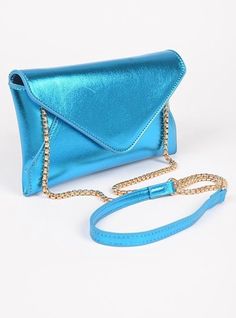 Metallic Envelope Clutch Swing Bag. Blue Flap Bag With Removable Pouch For Formal Occasions, Blue Satchel Flap Bag For Shopping, Blue Formal Flap Bag With Removable Pouch, Formal Blue Flap Bag With Removable Pouch, Elegant Blue Crossbody Clutch, Blue Rectangular Flap Bag For Formal Occasions, Formal Blue Rectangular Flap Bag, Blue Evening Flap Bag With Removable Pouch, Blue Clutch Shoulder Bag With Chain Strap