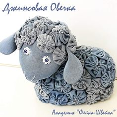 a stuffed animal made out of blue fabric