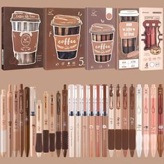 several different types of pens and pencils lined up in front of each other on a brown background