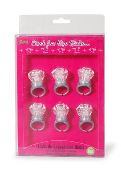 four silver rings in a pink package