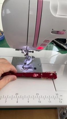 someone is using a sewing machine to sew something