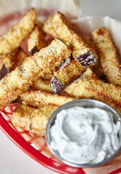 an image of french fries with dip on the side