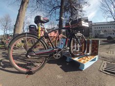 a bicycle is parked next to a bench