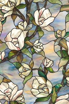 a stained glass window with white flowers on it