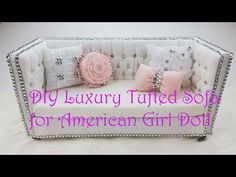 an american girl doll bed with pink and white pillows