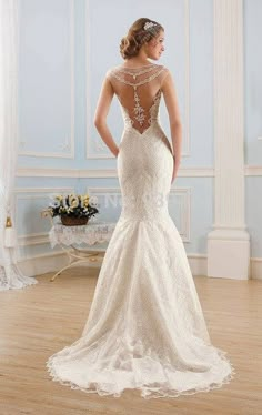 a woman in a wedding dress looking back