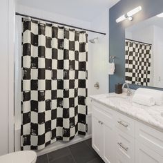 a black and white checkered shower curtain in a bathroom