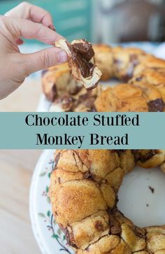 chocolate stuffed monkey bread on a plate with a bite taken out of it and the words, chocolate stuffed monkey bread