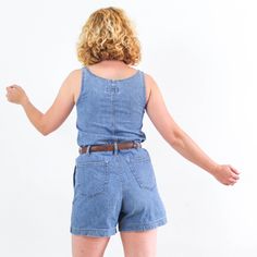 Amazing vintage 90's blue denim romper for womne. This vintage denim romper jumpsuit with shorts has button up, pockets and belt loops. The vintage denim playsuit romper is cotton fabric in excellent vintage conditions by Onyx. The size of this romper is Small, the chest contour fit is 31,4 inch. (80 cm) ** MEASURES FLAT ** Armpit to armpit 15,7 in // 40 cm Waist 16,5 in // 42 cm Hip 20 in // 51 cm Inner leg 4,3 in // 11 cm Front rise 11,4 in // 29 cm Length from shoulder 31,4 in // 80 cm Length Retro Denim Overall Jumpsuit For Summer, Summer Retro Denim Jumpsuit, Retro Summer Denim Jumpsuit, Retro Denim Jumpsuits And Rompers For Summer, Vintage Denim Jumpsuit With Relaxed Fit For Summer, Vintage Denim Jumpsuit Relaxed Fit For Summer, Vintage Denim Blue Jumpsuit For Summer, Vintage Denim Jumpsuit For Summer, Summer Vintage Denim Jumpsuit In Denim Blue