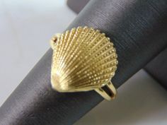 "A WOMENS VINTAGE ESTATE 14K GOLD SEASHELL RING. RING WEIGHS 4.8g, AND IS A SIZE 7.0. WIDTH OF THE RING IS 1/2\". RING IS STAMPED 14K ON THE INSIDE OF THE BAND. WOULD MAKE A LOVELY GIFT FOR THAT SOMEONE SPECIAL. BE SURE TO CHECK OUT SOME OF MY OTHER GREAT ITEMS UP FOR SALE. THANK YOU. IF THERE ARE ANY ISSUES PLEASE CONTACT US, WE'RE ALWAYS HAPPY TO TRY TO HELP YOU OUT AS BEST AS WE CAN." Elegant Shell-shaped Gold Rings, Elegant Gold Shell-shaped Rings, Gold Shell-shaped Ring For Gift, Gold Shell-shaped Gift Ring, Seashell Ring, Garnet And Diamond Ring, Dye My Hair, New People, Ring Ring