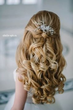 the back of a woman's head with curly hair