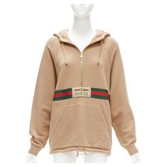 GUCCI Alessandro Michele beige cotton half zip vintage logo pullover XS Reference: LNKO/A02246 Brand: Gucci Designer: Alessandro Michele Model: 644656 XJC3W 2603 Material: Cotton Color: Beige, Multicolour Pattern: Striped Closure: Half Zip Lining: Beige Fabric Extra Details: Reminiscent of a vintage tracksuit, this hooded sweatshirt features a front zip detail and contrast red piping. Emblematic House codes, like the green and red Web stripe and the Gucci jacquard label, enrich the design. Made Gucci Alessandro Michele, Us Navy Women, Vintage Tracksuit, Zip Lining, Red Web, Gucci Brand, Mario Testino, Gucci Outfits, Gucci Designer