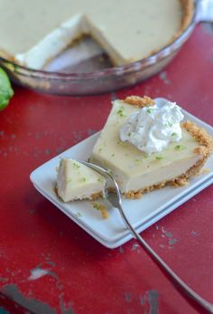 a slice of key lime pie on a plate with a fork