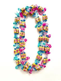 the letter o is made up of colorful beads and bows on it's sides