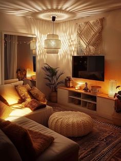 a living room filled with lots of furniture and lights on the wall above it's entertainment center