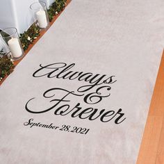 a wedding aisle runner with the words always and forever printed on it in black ink