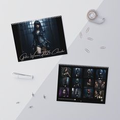 two calendars with photos on them next to pens and scissors