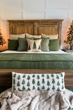 a bed with pillows and blankets on it in a room decorated for christmas or new year's eve