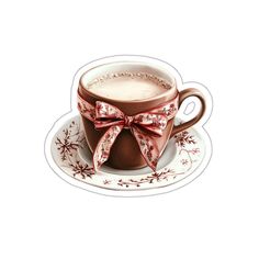 a cup of hot chocolate with a bow on the top is sitting on a saucer