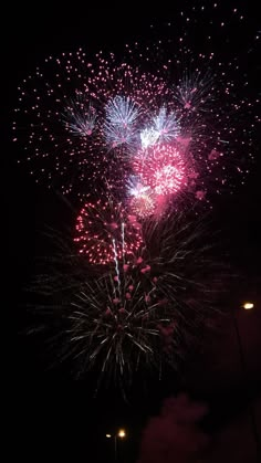 fireworks are lit up in the night sky