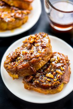 two white plates topped with french toast covered in caramel