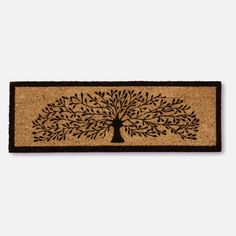 a door mat with a tree on it