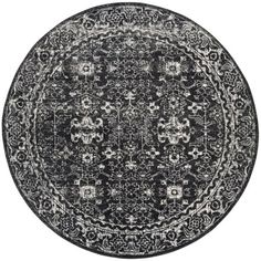 a black and white rug with an intricate design on the center, in front of a white background