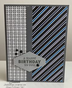 a happy birthday to you card with black and white striped paper on the bottom corner