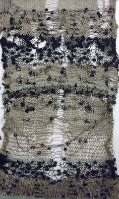 an old piece of cloth with black and white lace