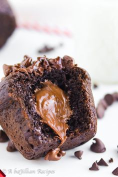 a close up of a chocolate muffin on a plate